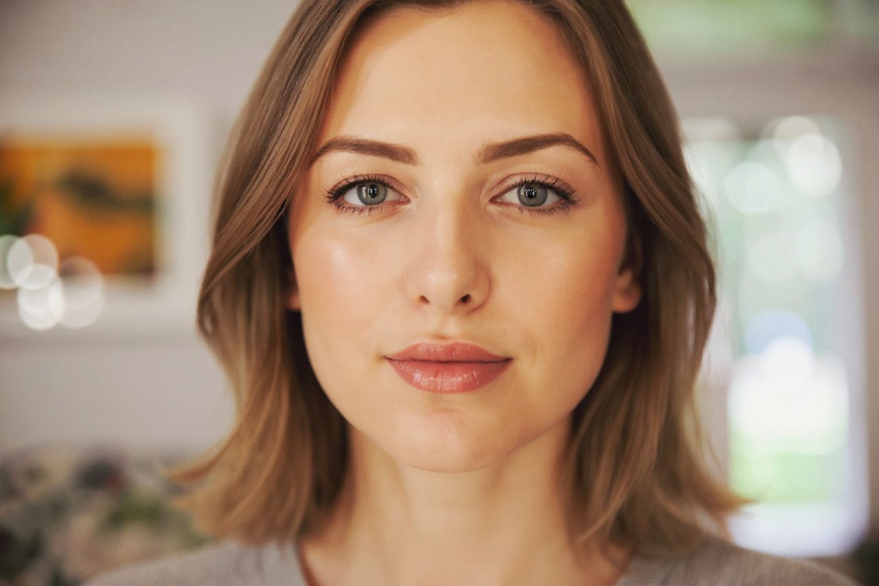 woman with fresh natural makeup look showing simple makeup style with soft lip color and subtle glow