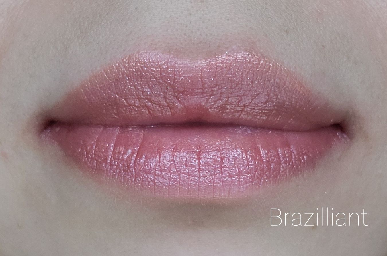 Image of close up lips wearing Lipstick by Red Apple Lipstick in the shade called Brazilliant. Pink with tangerine undertones, almost a light coral with some shimmer.