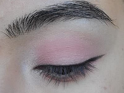 Image of eyelid with Black Magic Eyeshadow used as an eyeliner with a small wing on the outer corner edge 