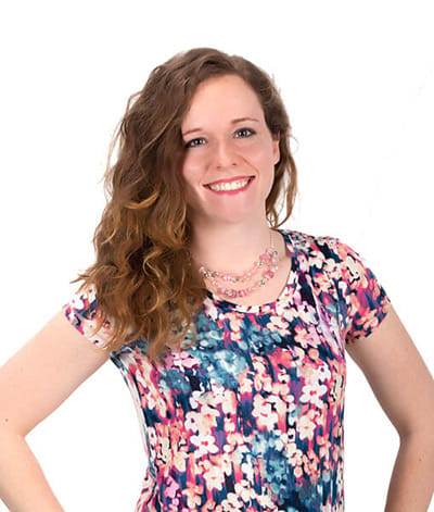 Image of lady with floral dress, long strawberry blonde hair, blue/green eyes and fair skin tone. She is featured wearing lipstick in the shade called Maven Mauve by Red Apple Lipstick. Maven Mauve is a dusty rose mauve color.