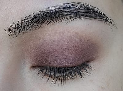Image of close up eye lid after Hush Hush Eyeshadow by Red Apple Lipstick has been applied onto the edges of Made You Wink eyeshadow and blended out.