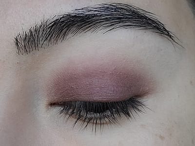 Image of close up eye after Plums Up! eyeshadow by Red Apple Lipstick has been applied.