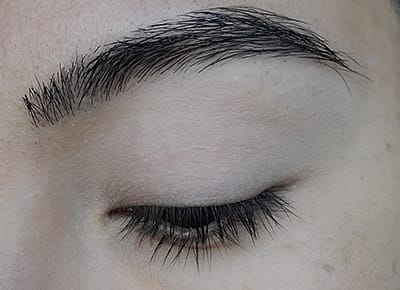 Image of close up eye lid after Porcelain eyeshadow has been applied as an all over base color. 