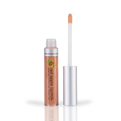 Image of tube of Diamond Sands lip gloss with wand standing next to the tube. Shiny and somewhat sheer. Nude/gold gloss with a subtle peach undertone
