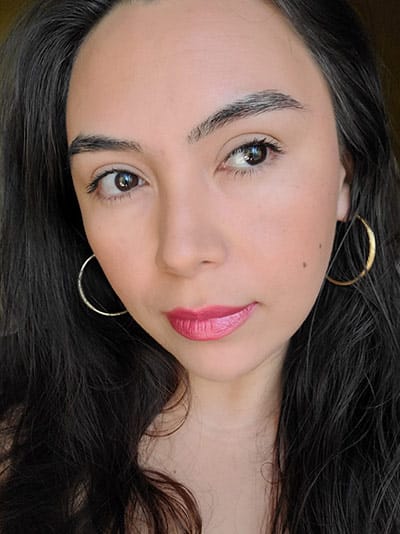 Image of lady with long dark hair, dark eyes and brows with medium skin tone. She is wearing Love My Kiss Lipstick, Coy Blush and Sundrop Bronzer on her complexion. Porcelain eyeshadow along with a little bronzer on the lid too and The Lash Project Mascara by Red Apple Lipstick 