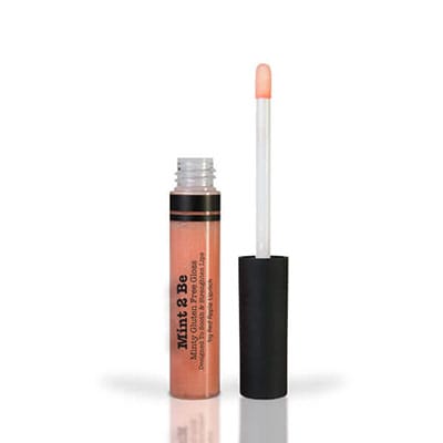 Image of lip gloss tube with the wand standing next to it in the shade called Sun Sparkles. Sun Sparkles is the perfect clear gloss with a touch of shimmer. It appears peachy in the tube, but when applied the peach tones blend perfectly into your base lip color providing a sheer gloss to make your lips shimmer and shine