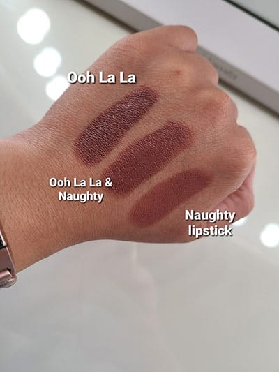 Image of back of hand model showing lipstick swatches with Ooh La La by itself, then Ooh La La with Naughty Lipstick and Naughty Lipstick by itself