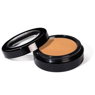 Image of Sundrop Bronzer by Red Apple Lipstick in it's container with the lid off and tilted to the side. Bronzer is a warm matte bronzer that is perfect for all skin tones