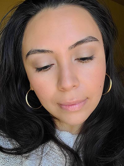 Image of lady with long dark hair, dark eyes and brows with medium skin tone. She is featured here after completing the Ethereal and Natural Summertime makeup look. All with Red Apple lipstick products.