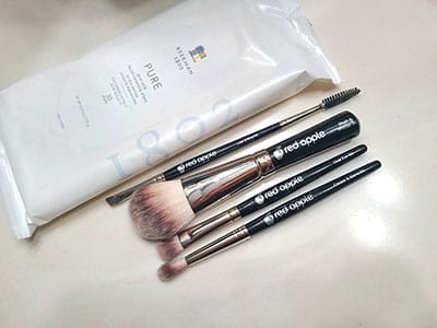 Image of an assortment of makeup application brushes by Red Apple Lipstick 