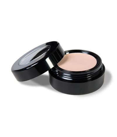Image of Prime Time Eyeshadow primer by Red Apple Lipstick in it's round case with the lid twisted of and placed to the side. 