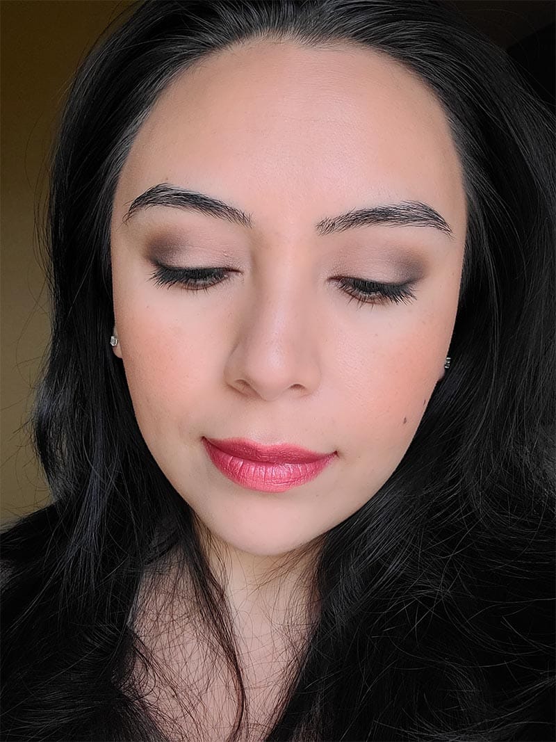 Girl wearing neutral eye shadow makeup with Strawberry Red lipstick by Red Apple Lipstick