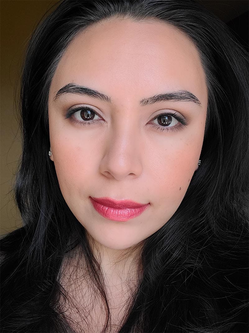 Girl wearing neutral eye shadow makeup with Strawberry Red lipstick by Red Apple Lipstick