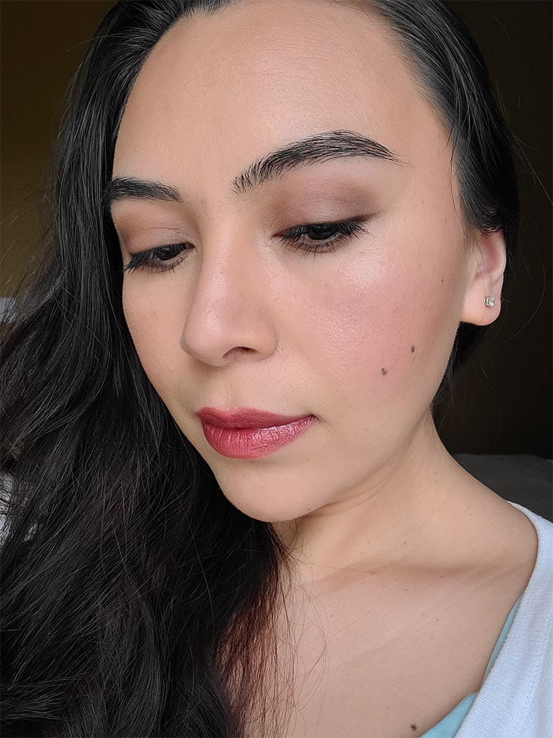 Girl wearing simple and soft eye shadow with a red bold lip